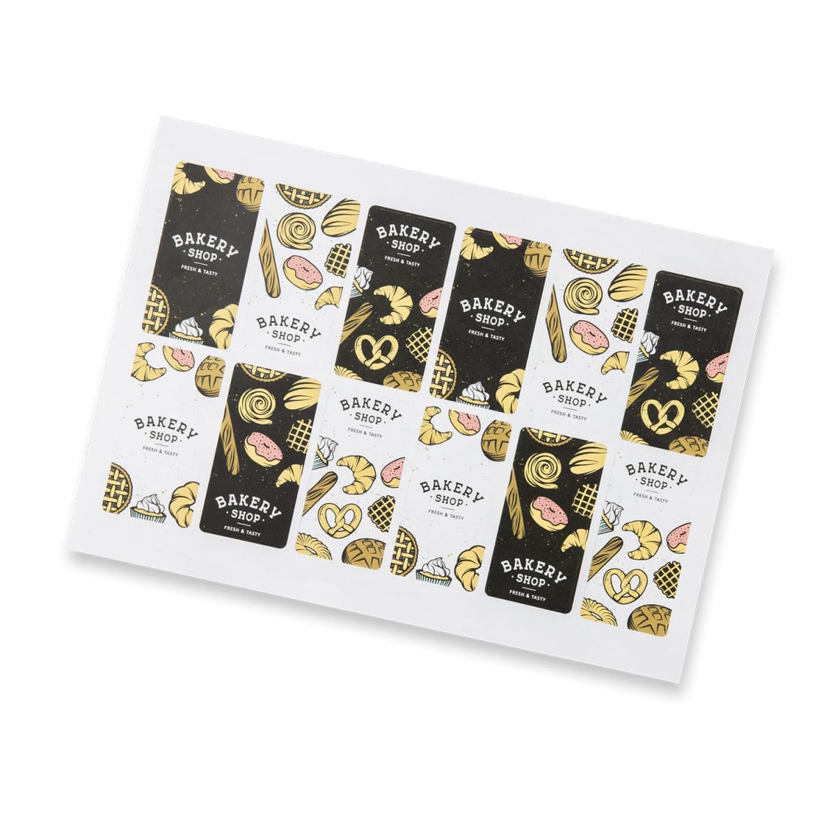 Stickers on a white sheet featuring various bakery-themed designs, including images of bread, pastries, and pretzels. The stickers have black, white, and gold backgrounds with Bakery Shop text.
