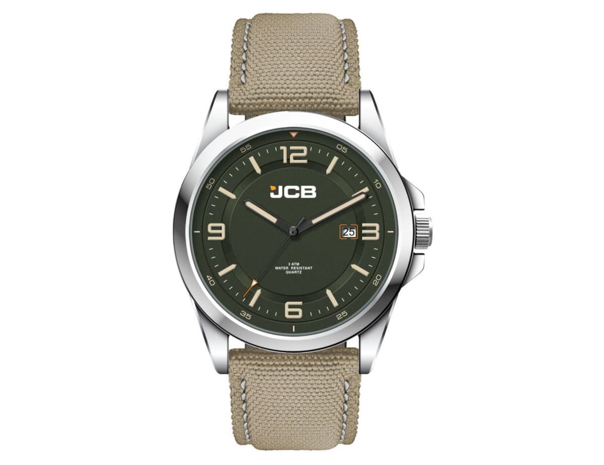A wristwatch with a green dial and beige strap. The watch face displays Arabic numerals, luminous hands, and a date window at 3 oclock. The case has a silver finish, and JCB is printed on the dial beneath the 12 oclock position.