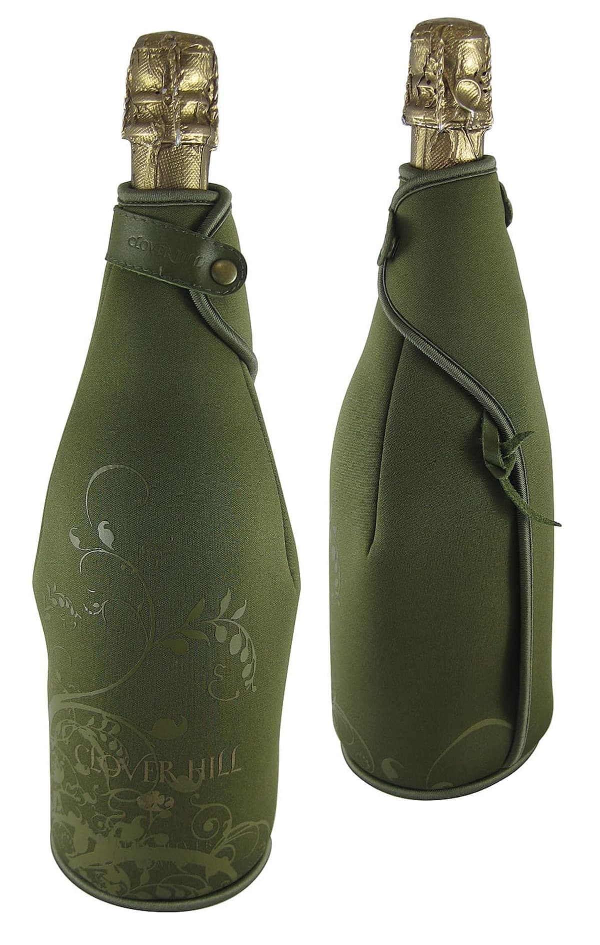 Two champagne bottles wrapped in green fabric with decorative floral patterns. The fabric covers the entire bottle, leaving only the gold foil tops exposed. The design features elegant curves and a buttoned strap.