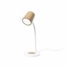 A modern desk lamp with a slender white stem and a brown, textured cylindrical lampshade, resting on a round white base. A power cord extends from the base.