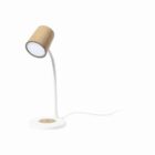 A modern table lamp with a cork-textured cylindrical shade, a white flexible neck, and a white round base. A power cord extends from the base. The background is plain white.