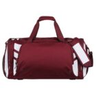 A maroon and white sports duffel bag with two handles and a shoulder strap. The main compartment is zippered with additional side pockets. The bag is set against a plain white background.