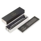 A Parker pen in a gift box with a branded card beside it on a white background.