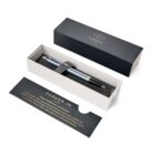 A Parker pen in a gift box with an informational card beside it.