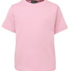 A plain pink short-sleeve T-shirt on a white background. It has a crew neckline and a small black label at the collar with white lettering.