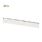 A transparent ruler made from wheat straw, marked with both metric and imperial measurements, is placed diagonally against a white background. The Wheat Straw logo is visible in the top left corner.