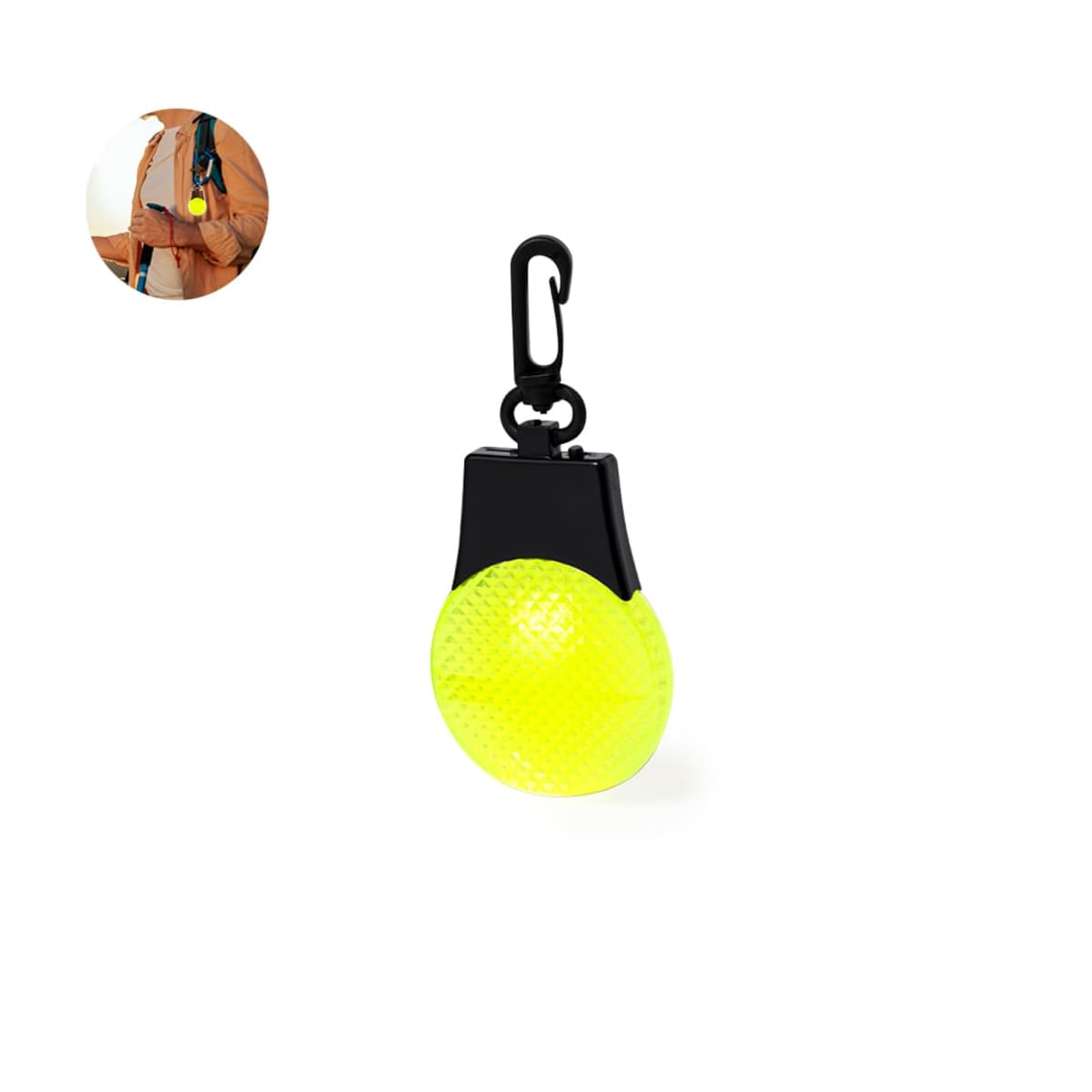 A round, bright yellow hanging accessory with a textured surface and a black clip. In the corner, theres a small image of someone attaching it to a brown jacket.