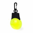 A small, round, bright yellow reflective light attached to a black clip, designed for safety visibility.