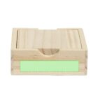 A small, unfinished wooden box with a slide top is shown. The front of the box features a rectangular, light green area suggesting a customizable label space.