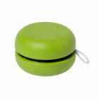 A green yo-yo with a smooth, rounded design. A white string is attached to its center, coiled up neatly. The yo-yo is set against a plain white background.