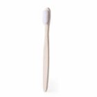 A bamboo toothbrush with white bristles, standing upright against a plain white background.
