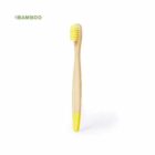A bamboo toothbrush with yellow bristles and a yellow tip on the handle is shown against a white background. The word Bamboo is written in green text in the top left corner.