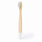 A bamboo toothbrush with soft white bristles and a white dipped handle, standing upright against a plain white background.