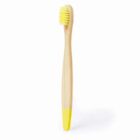A bamboo toothbrush with yellow bristles and a matching yellow tip on the handle, standing upright against a white background.