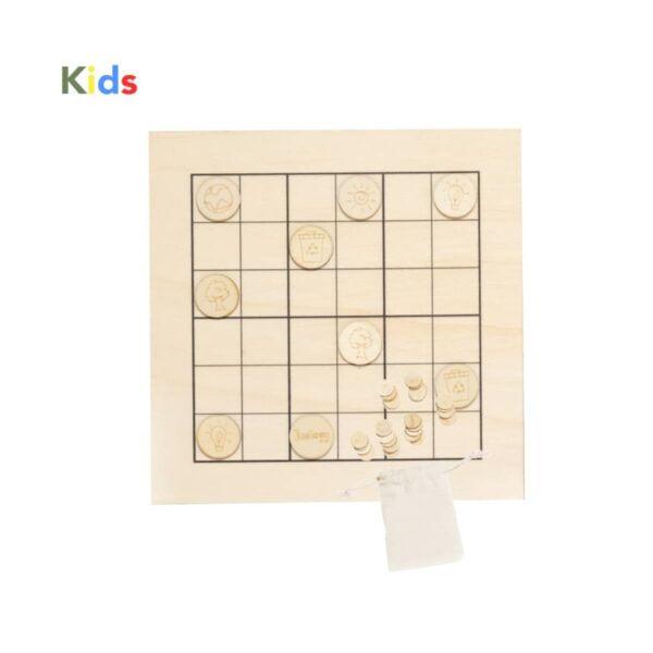 A wooden tic-tac-toe board with engraved symbols on square tiles, placed on a grid. Some tiles are marked, and there is a small fabric bag beside the board. The word Kids is written in colorful letters at the top.