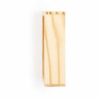 A wooden block standing upright against a plain white background. The block has a smooth surface with visible wood grain patterns along its length.
