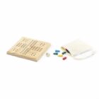 A wooden Ludo game set featuring a board with engraved track lines, a six-sided die, colorful playing pieces, and a small drawstring bag for storage. The pieces are scattered beside the board, ready for play.