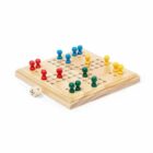 A wooden board game with colored pegs (red, blue, green, yellow) arranged on a grid pattern. A six-sided die is placed nearby.