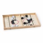 A wooden board game with two sections separated by a barrier, featuring black and white circular pieces on each side. The board has markings, including red circles and black lines, resembling a tabletop strategy or dexterity game.