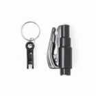 A black emergency tool featuring a seat belt cutter and a glass breaker, attached to a silver keyring. The tool is compact and portable, designed for safety and emergency use in vehicles.