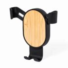 A black phone holder with a circular wooden panel in the center, featuring two side grips and a bottom support for securely holding a device.