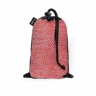 A red and black mesh drawstring bag with a textured appearance. The bag is cinched at the top with a black drawstring and a small black tag is visible on the side.