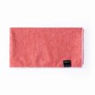 A folded red towel with a small black label, marked RPET, on one corner. It lies on a plain white background.