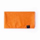A folded orange towel with a small black tag on one corner displaying the text RPET. The towel has a simple design and white stitching along the edge.