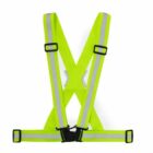 A fluorescent yellow safety vest with reflective strips displayed on a plain white background. The vest is shaped like an X with adjustable black buckles.