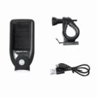 A black solar headlight with a solar panel, a bike mounting bracket, and a USB charging cable on a white background.