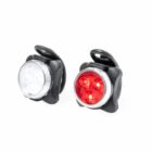 Two small, round bike lights are shown. One has a clear lens with white LEDs, and the other has a red lens with red LEDs. Both have black casings and rubber straps for attachment.