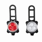 Two bicycle tail lights with black rubber mounts. The left light has three red LED bulbs, while the right has three white LED bulbs. The mounts have a ladder-like design for easy attachment to bike frames.