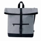 A stylish gray backpack with a roll-top closure, secured by a black strap and buckle. It features a front zippered pocket and black bottom trim. The bag has a black handle and adjustable shoulder straps.