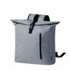 A gray backpack with a roll-top closure and black straps. It features an exterior vertical zippered pocket on the front and has a sleek, modern design.