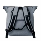 A gray backpack with black adjustable straps and a top flap design is shown from the back. The straps have padding and a secure buckle. The fabric appears durable, and the overall design is simple and functional.