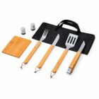 Grill tool set with spatula, fork, knife, tongs, salt, pepper, board, and carrying case.