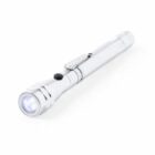 A silver pen-style flashlight with an LED bulb is shown. It has a side clip for attachment and a black button near the top for on/off functionality. The flashlight is slightly angled, displaying its sleek and compact design.