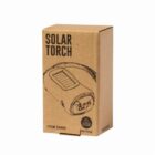 A cardboard box labeled Solar Torch with an illustration of a torch featuring a solar panel on top. The box includes item number 20490, and a symbol indicating solar energy usage.