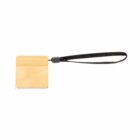 Square wooden keychain with a black strap attached, isolated on a white background.