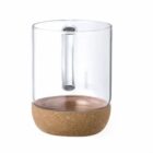Clear glass cup with a cork base and a glass handle, isolated on a white background.