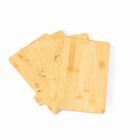 Four wooden cutting boards with small food icons on the tabs, fanned out on a white background.