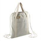 Beige fabric tote bag with drawstring closure, front pocket, and double handles.