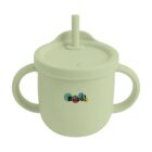 A pastel green silicone sippy cup with two handles and a lid featuring a small spout and straw. The brand name Bilbo! is printed on the front in multicolored letters.
