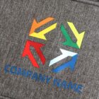 A logo featuring four arrows in orange, green, red, and blue, arranged to form a square shape, with the words COMPANY NAME in blue text below, set against a textured gray background.