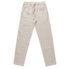 Beige linen pants with an elastic waistband and drawstring, laid flat on a white background. They appear lightweight and comfortable, suitable for casual wear.