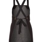 A black apron with cross-back straps and a tie at the waist. The apron features a simple, classic design with stitching visible on the edges.