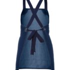 A dark blue denim apron with crossed straps and an adjustable tie at the back, featuring a sleek design without visible pockets.