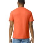 A person with short hair and a beard is viewed from behind, wearing a plain orange T-shirt and light blue jeans.