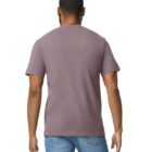 A person wearing a plain brown T-shirt and blue jeans is standing with their back to the camera against a white background. The persons left arm is slightly bent.