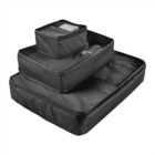 Three black packing cubes are stacked on top of each other. The smallest cube is on top, followed by a medium and a large cube. Each cube has a zipper and mesh panel for visibility.